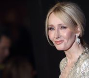 Harry Potter author JK Rowling wears a gold, glittery outfit as she poses for the camera