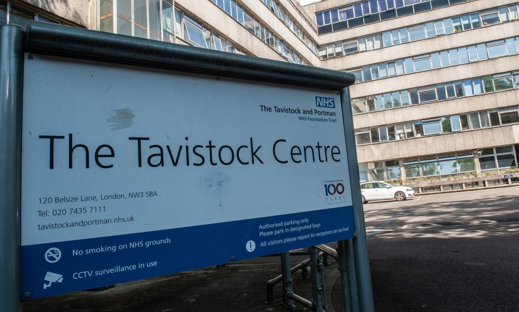 A sign outside of the Tavistock and Portman NHS Foundation Trust, which houses England's only trans youth clinic. The sign reads "The Tavistock Centre" along with an address and notices about CCTV.