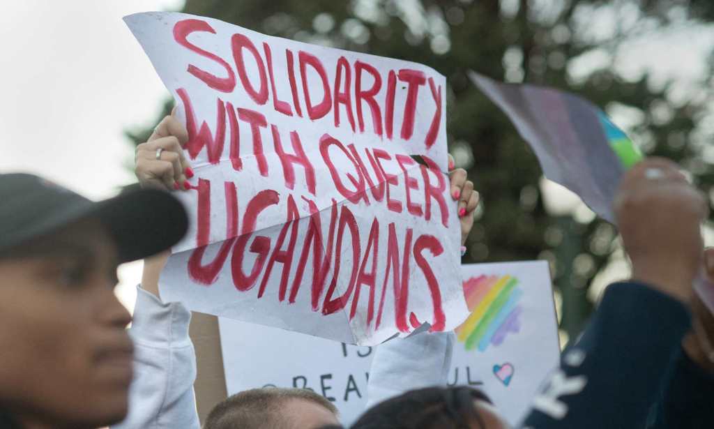 Protesters waves placards while joining supporters of the LBTQ community as they stage a protest against a planned lecture by Kenyan academic Patrik Lumumba (not visible) at the University of Cape Town on July 24, 2023. Lumumba, who has been invited to address a keynote speech by the South African opposition party Economic Freedom Fighters, has been contested because of his views on homosexuality and his support for Uganda's anti-homosexuality bill. (Photo by RODGER BOSCH / AFP) (Photo by RODGER BOSCH/AFP via Getty Images)