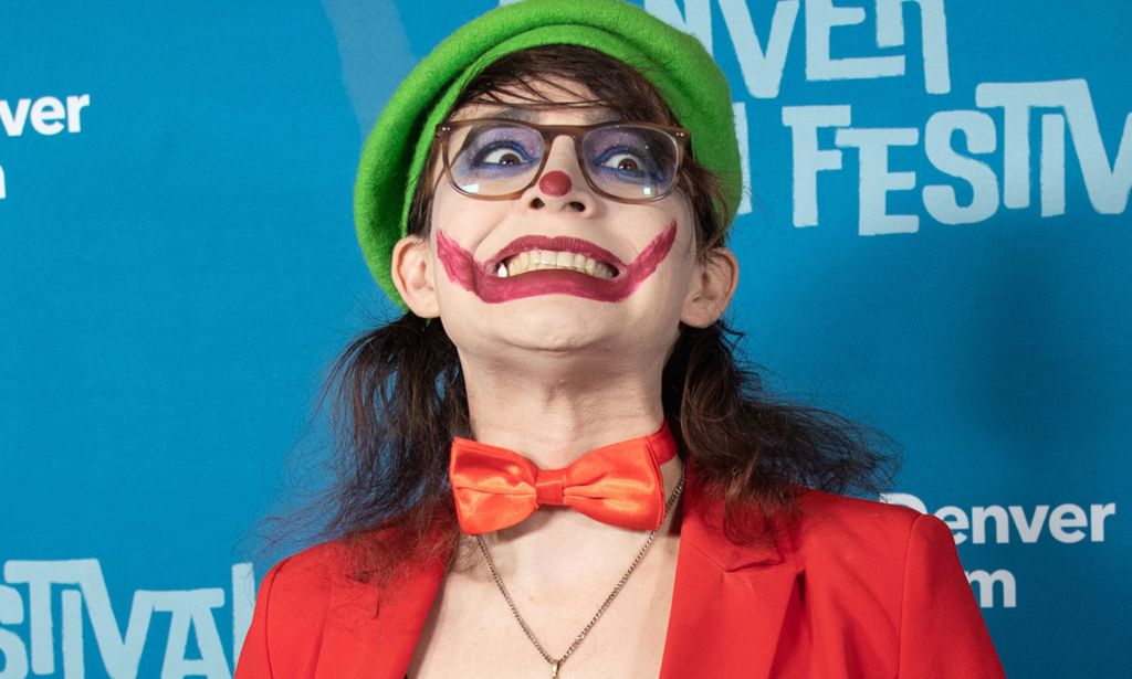 The People's Joker star Vera Drew on the red carpet wearing a joker costume.