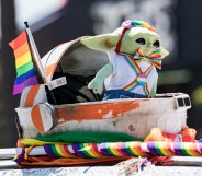 Photo taken at San Diago Pride showing Grogu from The Mandalorian in Pride themed rainbow outfit