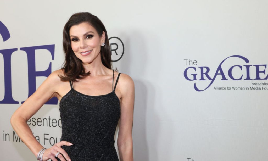 This is an image of Heather Dubrow on a red carpet.
