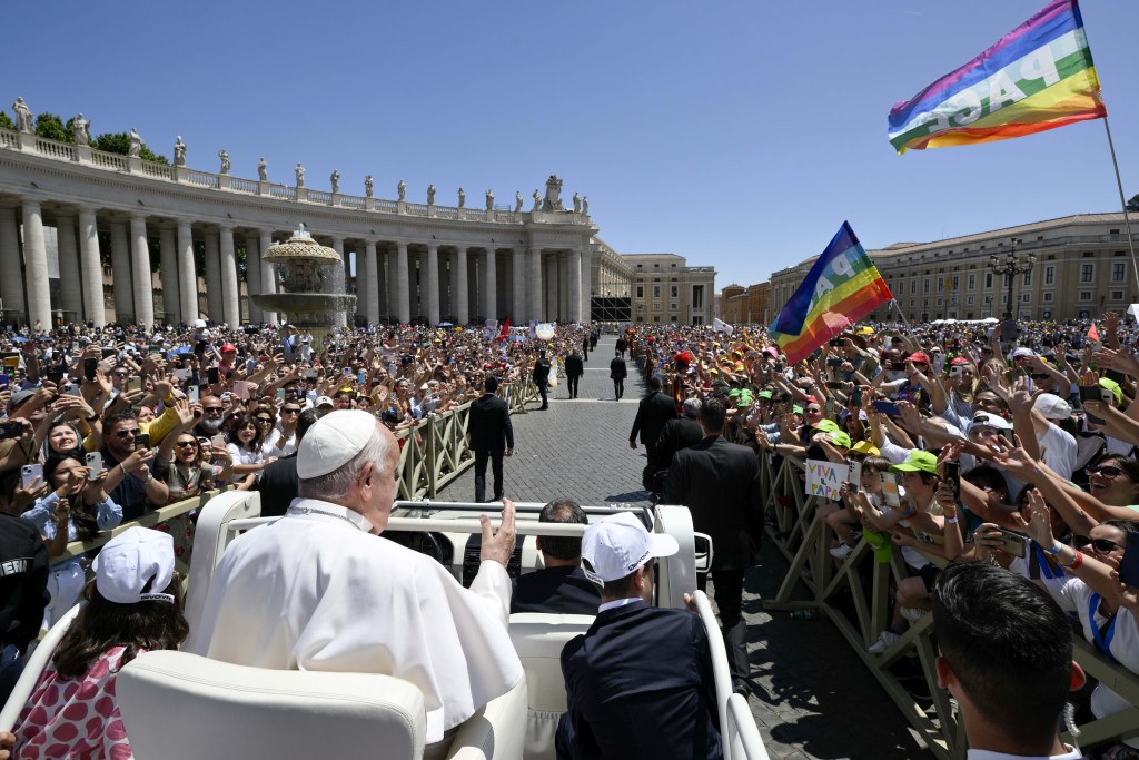 Pope Francis waves to faithful gathered St.Peter’s Square for a Mass