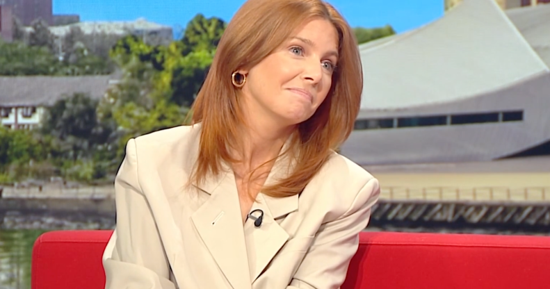 Stacey Dooley on BBC Breakfast, she's wearing a white blazer and sitting on a red sofa