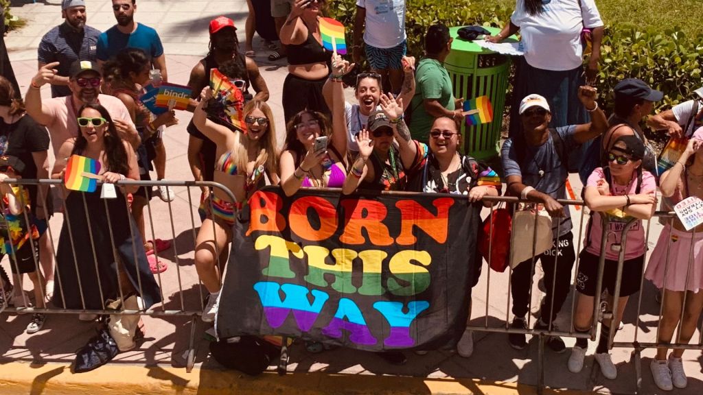 Pride-goers wave a banner reading "Born This Way" during Miami Beach Pride 2024
