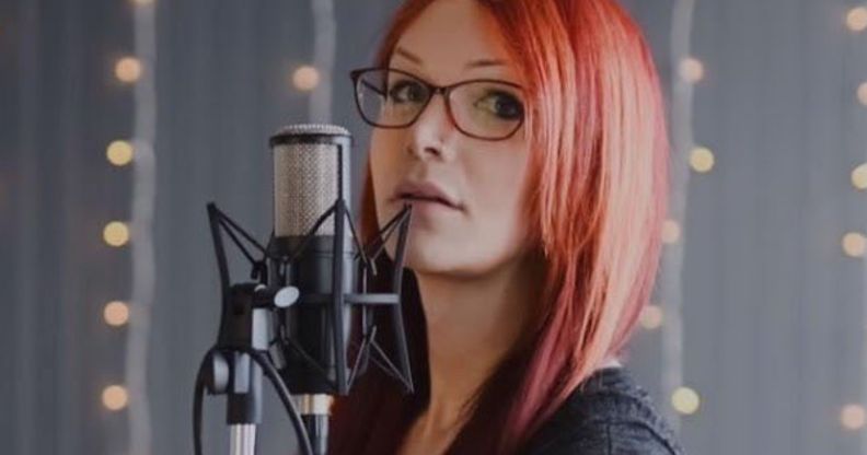 Voice Actress, Zoey Alexandria, who voices The Unknown in Dead By Daylight, in front of a microphone