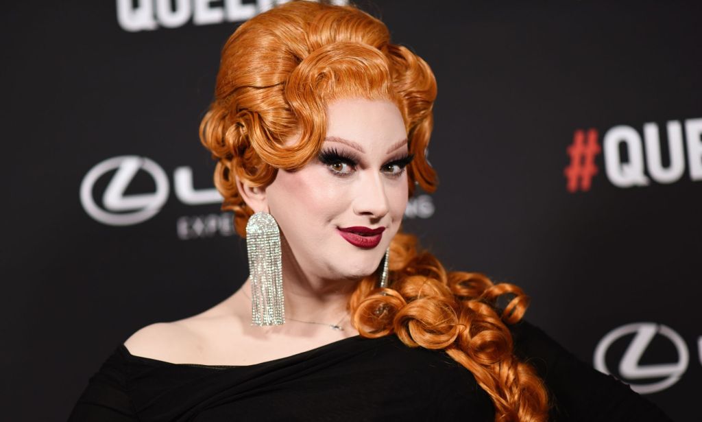 Jinkx Monsoon looks to the left and smiles.