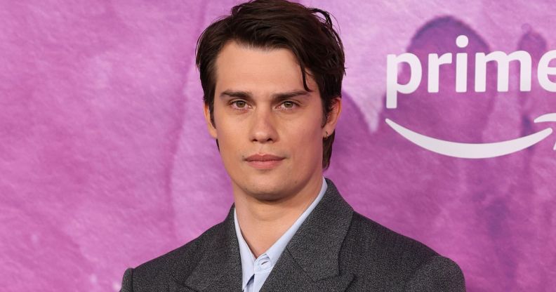 Nicholas Galitzine poses on the red carpet at the Idea of You launch.