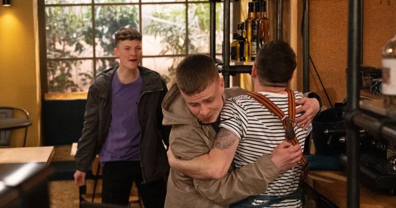 Image shows the moment in the fight where Samson is accidentally stabbed by Matty. Matty is facing away from the camera and Samson is facing towards it. Josh is in the background.