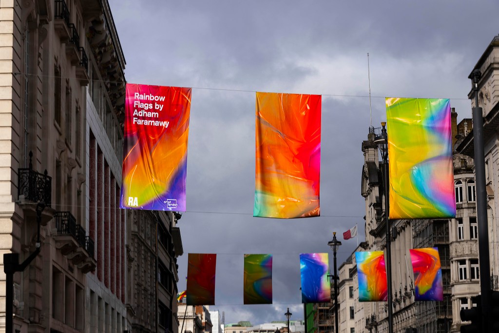 Artist and RA alumni Adham Faramawy's collection of new flags titled ‘Rainbow Flags’ at Piccadilly in London, commissioned by Art of London and Art in Mayfair in partnership with the Royal Academy of Arts