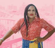 This is an image of a Black trans woman named Imara Jones. She is wearing a red shirt and a colourful skirt.