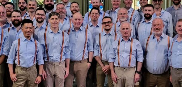 Dublin Gay Men's Chorus photographed wearing rainbow suspenders.