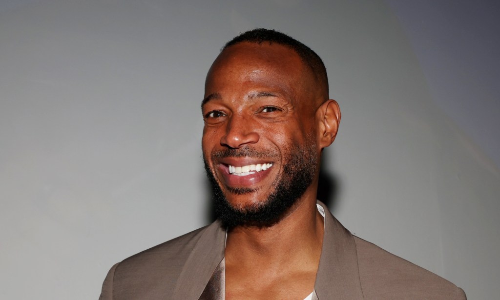 Marlon Wayans attends his screening of Good Grief, smiling at the camera.