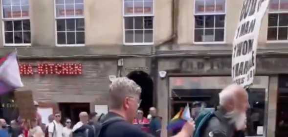Dad Dan Bretherton has been hailed a 'legend' for putting a Pride flag in the backpack of a lone protester a Edinburgh Pride.