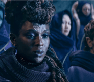 Mother Aniseya is in the foreground, she is Black and wearing robes with a spiral sigil on her head. Mother Koril is to the right, she is white with blue markings on her face and horns.