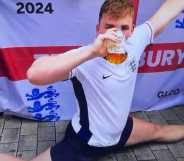 An England Euro 2024 supporter doing the splits and downing a pint