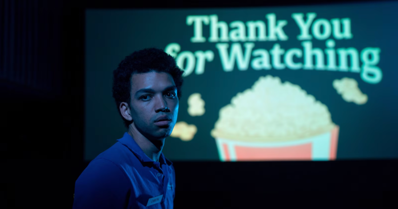 A still from I Saw The TV Glow featuring Owen looking away from a screen that reads "Thank you for watching"