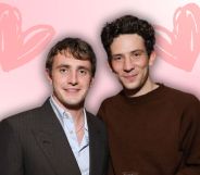 Paul Mescal and Josh O'Connor pose together. They are edited onto a pink background with love hearts on either side of them.
