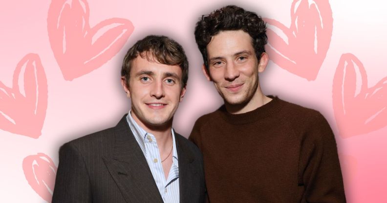 Paul Mescal and Josh O'Connor pose together. They are edited onto a pink background with love hearts on either side of them.