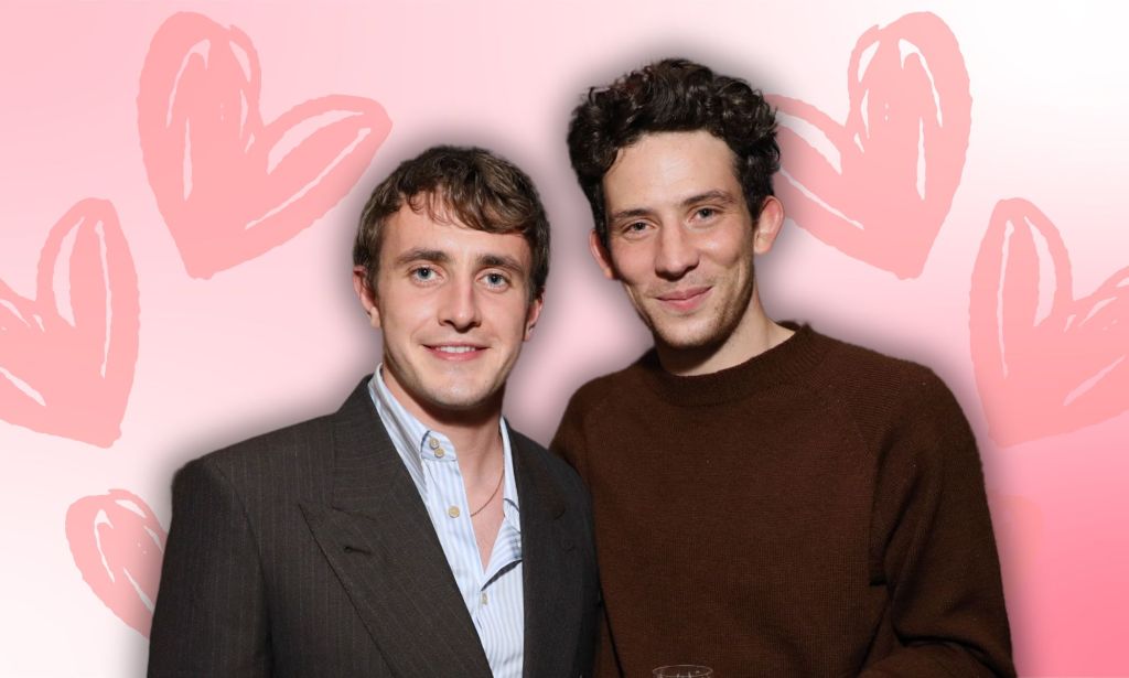 Paul Mescal and Josh O'Connor pose together. They are edited onto a pink background with love hearts on either side of them.