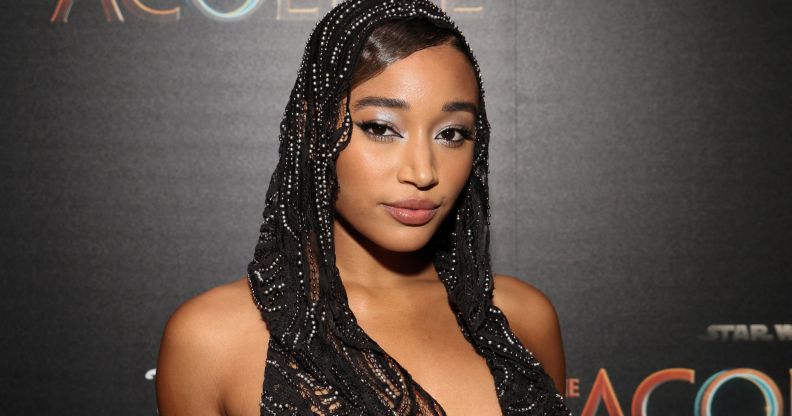 Amandla Stenberg wears a black lacy head covering while on the red carpet premiere of Star Wars: The Acolyte.