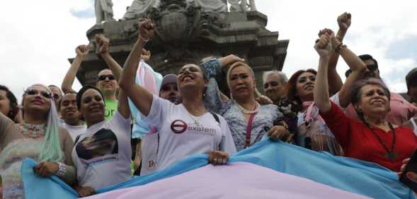 Activist Kenia Cuevas leads a demonstration at the Angel de la Independencia for the "Paola Buenrostro Law".