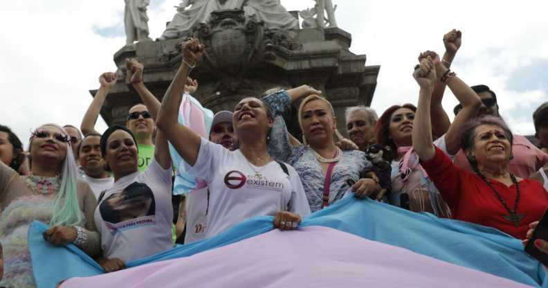 Activist Kenia Cuevas leads a demonstration at the Angel de la Independencia for the "Paola Buenrostro Law".