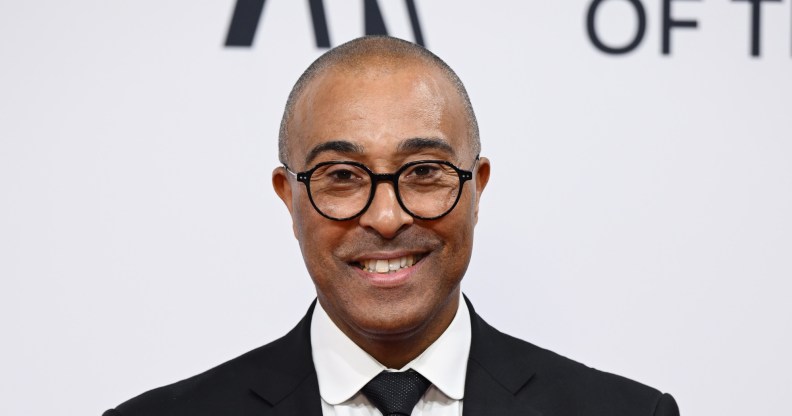 Colin Jackson at the BBC Sports Personality Of The Year 2023, wearing a suit and smiling at the camera.