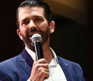 Donald Trump Jr speaking into a microphone.