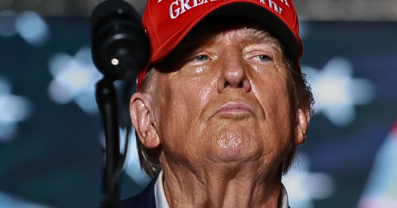 Donald Trump, pictured in a red hat.