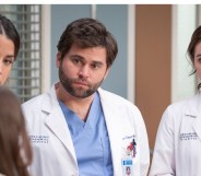 Three Grey's Anatomy doctors around the bed of a patient