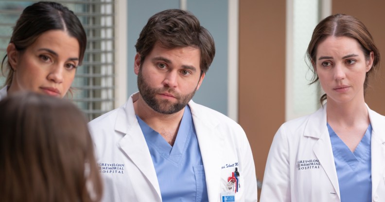 Three Grey's Anatomy doctors around the bed of a patient