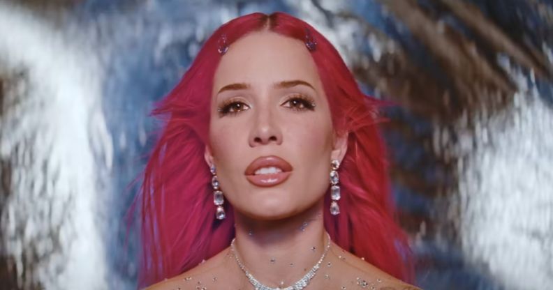 Halsey in a pink wig in a still from her new single Lucky.