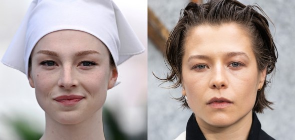 Hunter Schafer wearing a white hat over her hair and Emma D’Arcy wearing a black and white suit at a premiere.