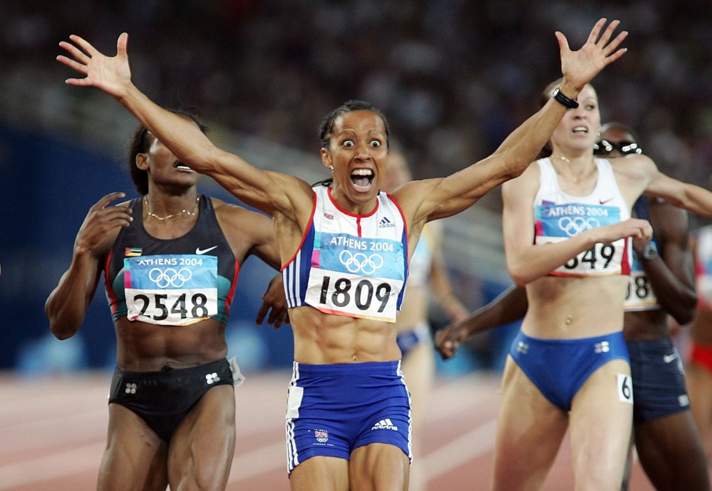 Kelly Holmes of Great Britain celebrates after she won gold in the women's 800 metre final