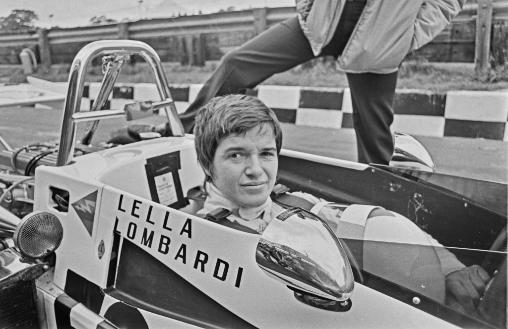 Black and white image of Lella Lombardi in her race car