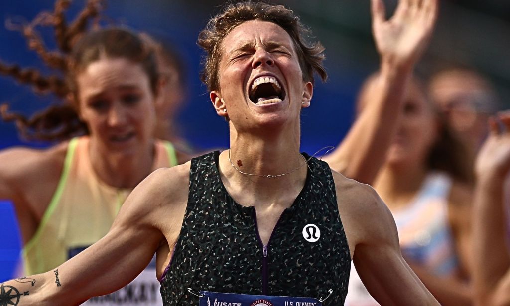 Nikki Hiltz, with their eyes closed, screams in victory after winning the 1500m race.