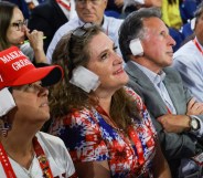 MILWAUKEE, WISCONSIN - JULY 17: People wear "bandages" on their ears as they watch on the third day of the Republican National Convention at the Fiserv Forum on July 17, 2024 in Milwaukee, Wisconsin. Delegates, politicians, and the Republican faithful are in Milwaukee for the annual convention, concluding with former President Donald Trump accepting his party's presidential nomination. The RNC takes place from July 15-18. (Photo by Joe Raedle/Getty Images)