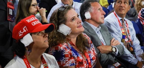 MILWAUKEE, WISCONSIN - JULY 17: People wear "bandages" on their ears as they watch on the third day of the Republican National Convention at the Fiserv Forum on July 17, 2024 in Milwaukee, Wisconsin. Delegates, politicians, and the Republican faithful are in Milwaukee for the annual convention, concluding with former President Donald Trump accepting his party's presidential nomination. The RNC takes place from July 15-18. (Photo by Joe Raedle/Getty Images)