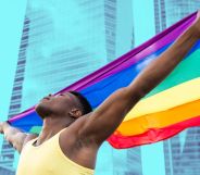 This is an image of a Black man holding a Pride flag in front of an office building
