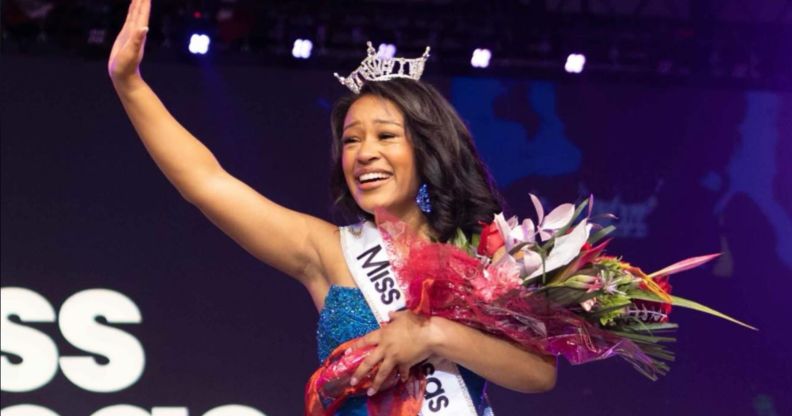 Alexis Smith, winner of the Miss Kansas beauty pageant wearing her crown, a sash, and holding a bouquet of flowers