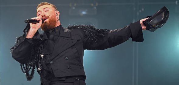 Sam Smith performing in an all-black outfit in the Netherlands