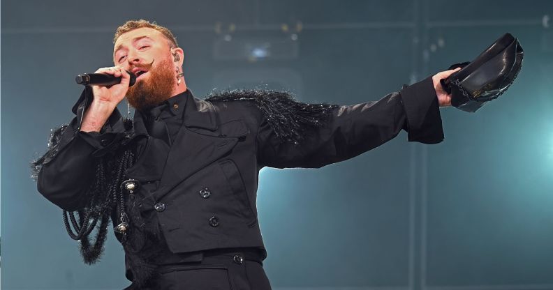 Sam Smith performing in an all-black outfit in the Netherlands