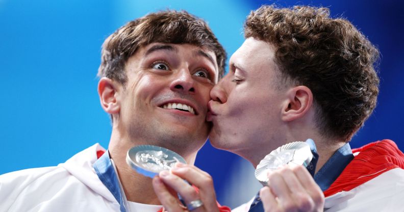 Noah Williams kisses Tom Daley after they won silver at the Paris 2024 Olympics.