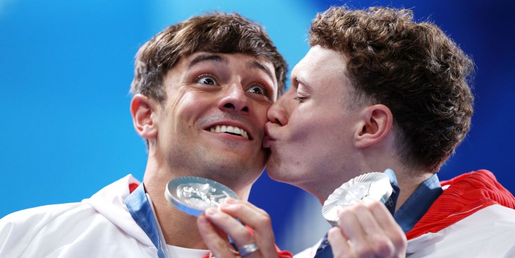 Noah Williams kisses Tom Daley after they won silver at the Paris 2024 Olympics.