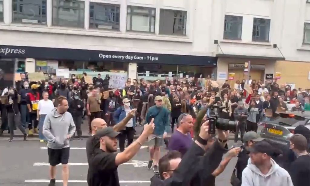 Anti-fascist protestors telling far-right rioters to 'get off our streets'.