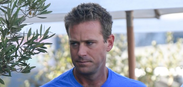 Armie Hammer is seen on July 18, wearing a blue t shirt