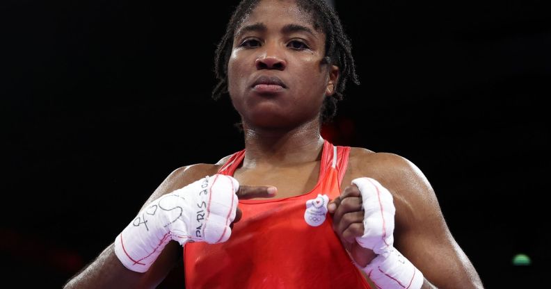 Cindy Ngamba making a fist in a Olympic ring.