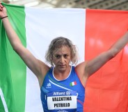 Valentina Petrillo holding an Italian flag