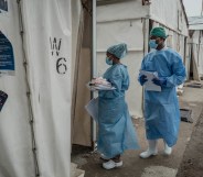 Health workers walk between wards at the Mpox treatment centre at Nyiragongo General Referral Hospital.